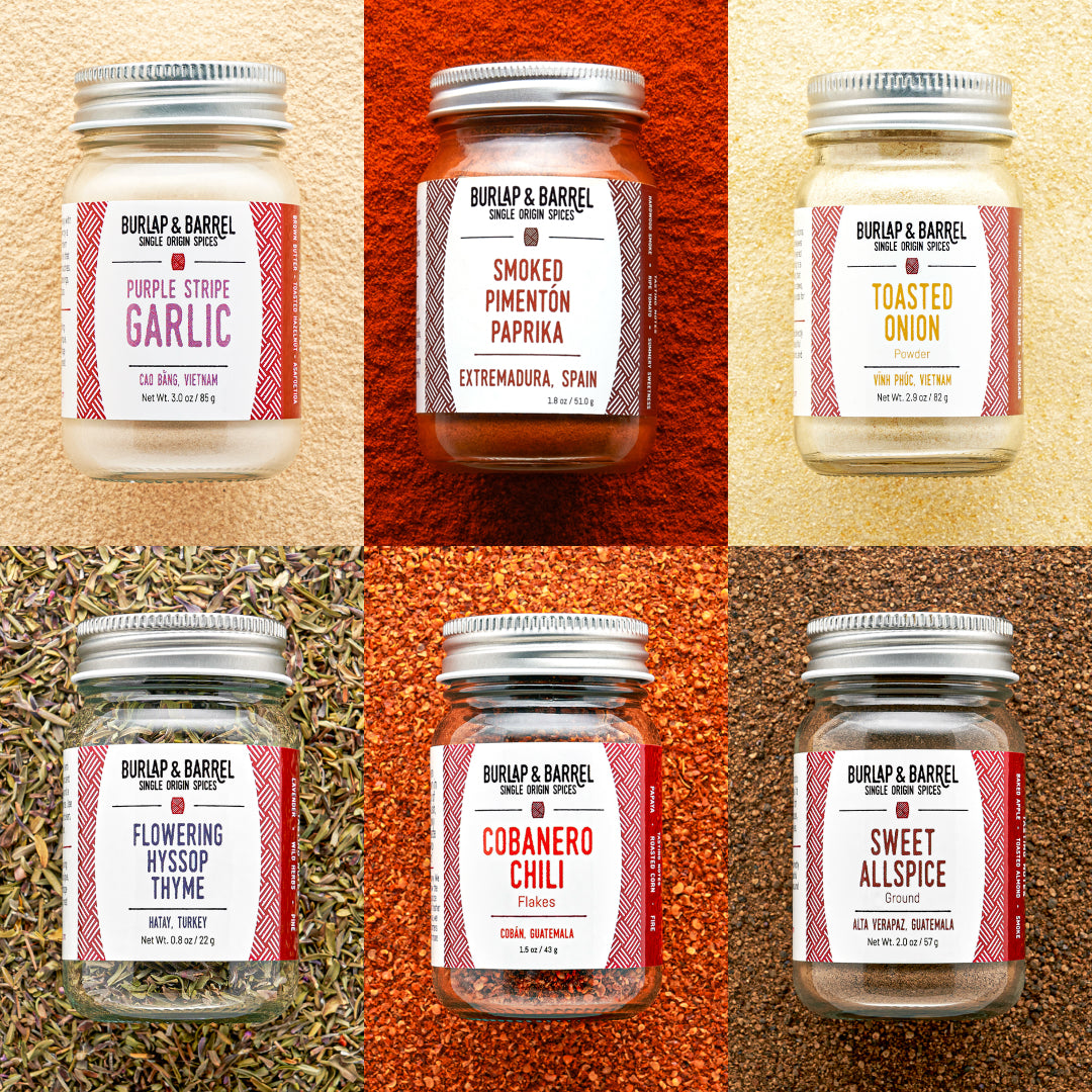 Collage of Burlap & Barrel spice jars with labels on a textured background