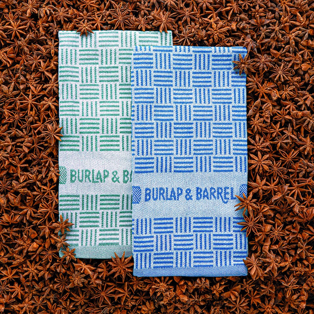 Two patterned towels from Burlap & Barrel on a star anise background