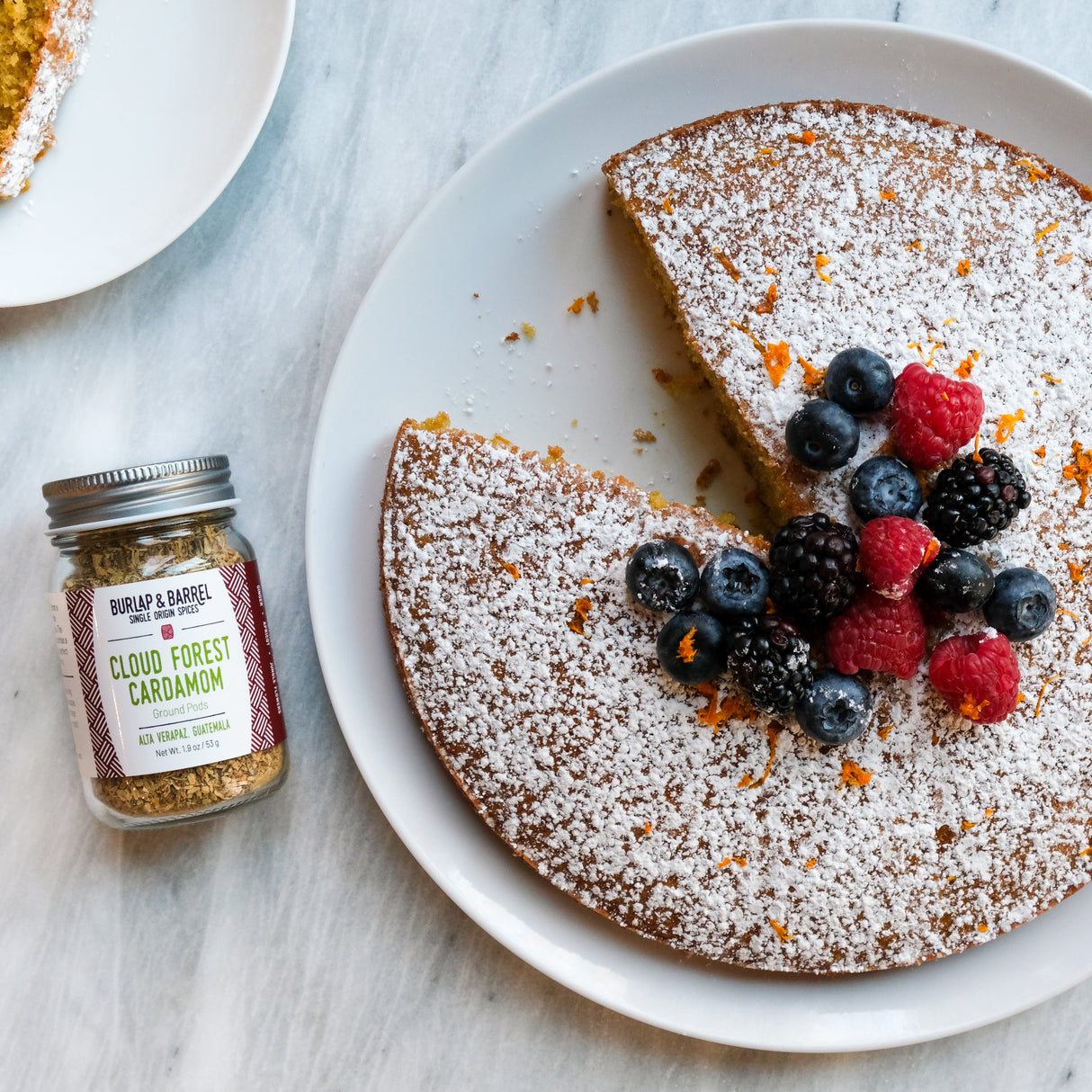 Cloud Forest Cardamom cake with an assortment of berries