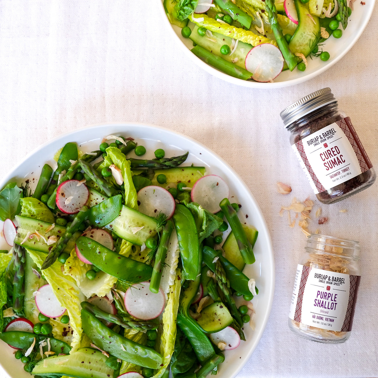 Spring vegetable Salad with cured sumac and purple shallot slices from Burlap & Barrel