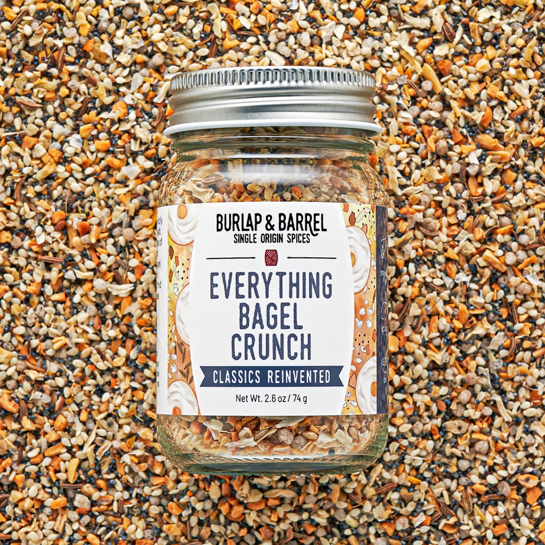 Jar of 'Everything Bagel Crunch' seasoning mix on a textured surface