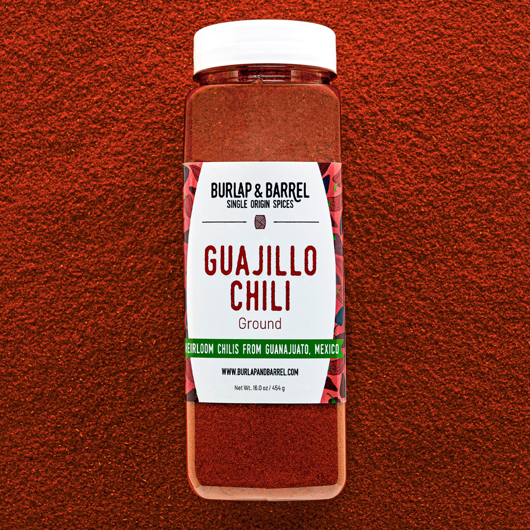 Container of Burlap & Barrel Guajillo Chili on a red background