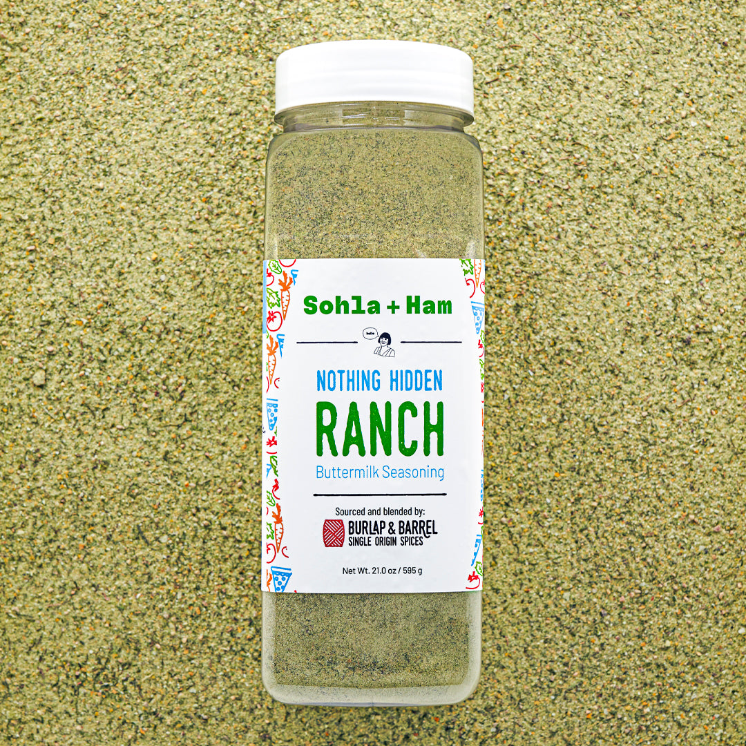 Bottle of Sohla + Ham Nothing Hidden Ranch seasoning from Burlap & Barrel on a textured beige background