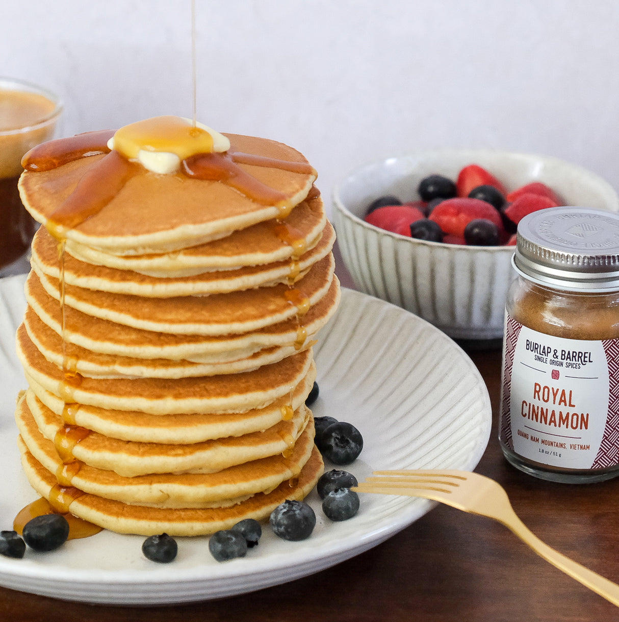 Royal Cinnamon and a stack of Pancakes and berries
