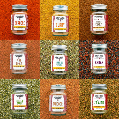 Grid of Burlap & Barrel Origin Blend jars with labels on a textured brown background