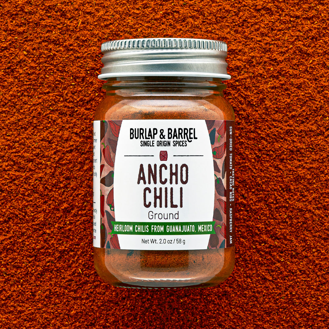 Bottle of Burlap & Barrel Ancho Chili on a textured brown background
