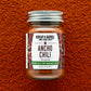 Bottle of Burlap & Barrel Ancho Chili on a textured brown background
