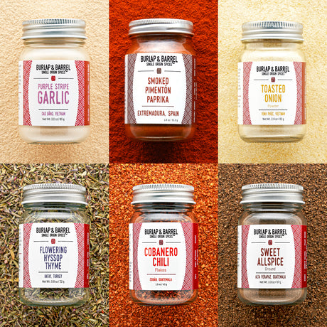 Collage of Burlap & Barrel spice jars with labels on a textured background