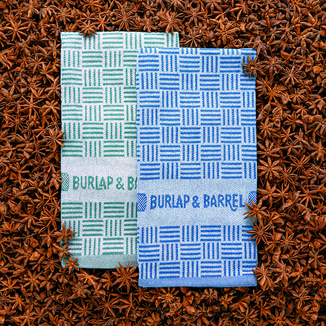 Two patterned towels from Burlap & Barrel on a star anise background