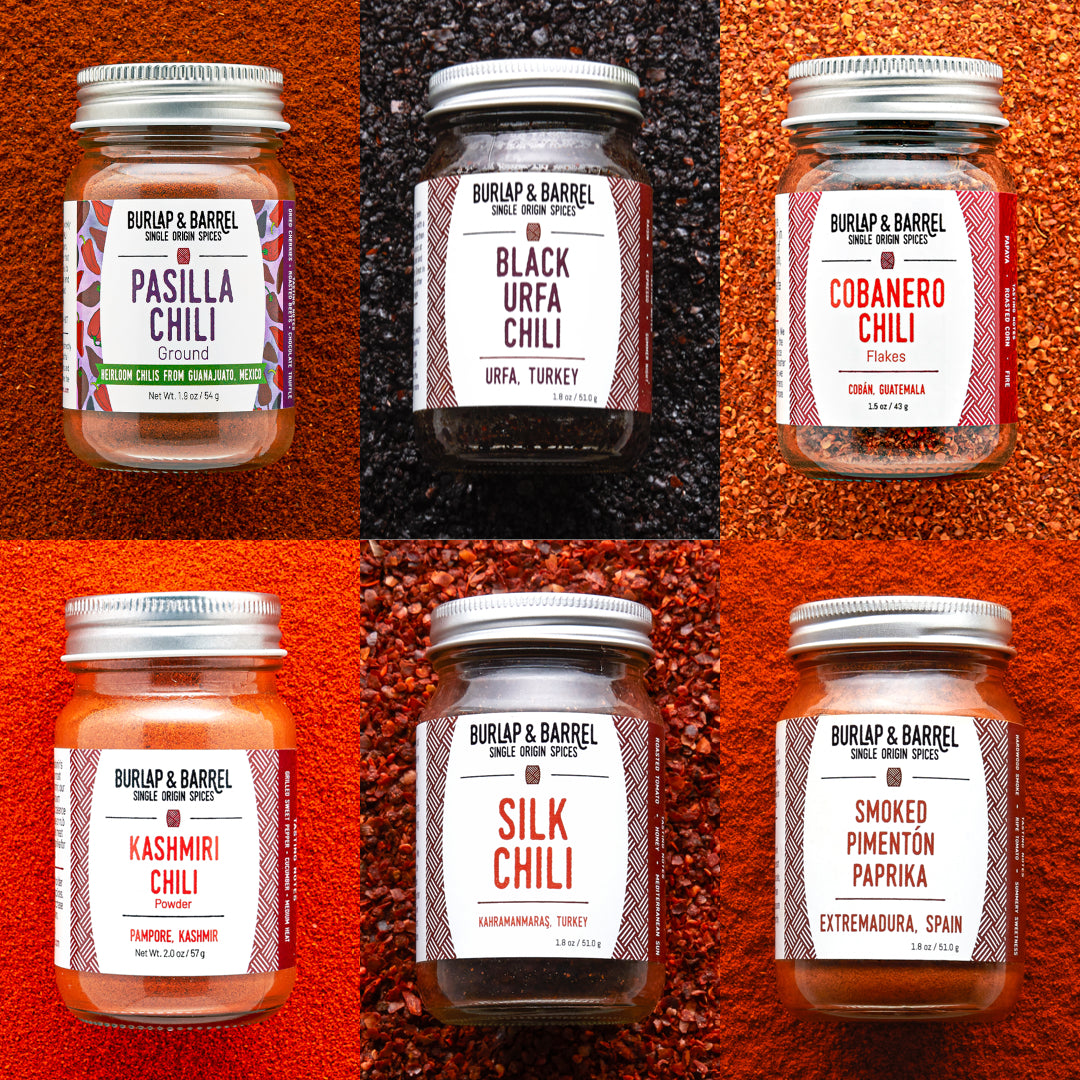 Collage of Burlap & Barrel chili jars with labels on a textured red background