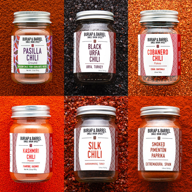 Collage of Burlap & Barrel chili jars with labels on a textured red background