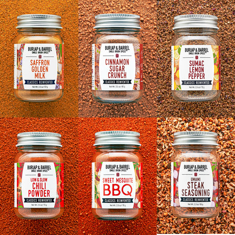A collection of 6 spice blends on multi-colored textured background from Burlap & Barrel