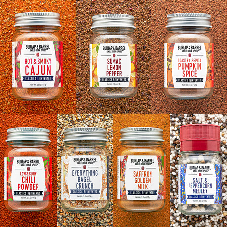 Six jars of Burlap & Barrel Seasoned Breweries spices arranged in a 2x3 grid, each set against a textured background matching the spice blend inside. The products include Hot & Smoky Cajun, Sumac Lemon Pepper, Toasted Pumpkin Spice, Low Sodium Chili Powder, Everything Bagel Crunch, Saffron Golden Milk, and Salt & Peppercorn Medley.