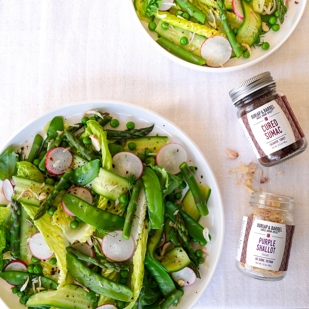 Spring vegetable Salad with cured sumac and purple shallot slices from Burlap & Barrel
