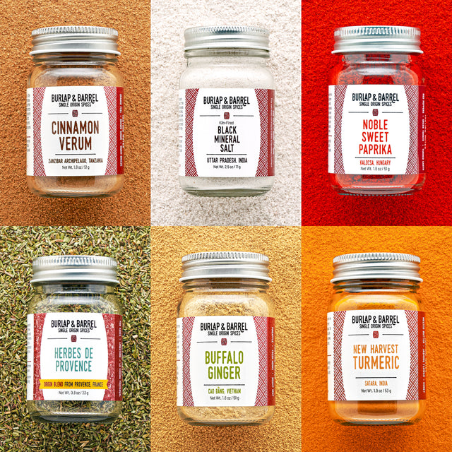 Collage of Burlap & Barrel spice jars with labels on a multicolored background