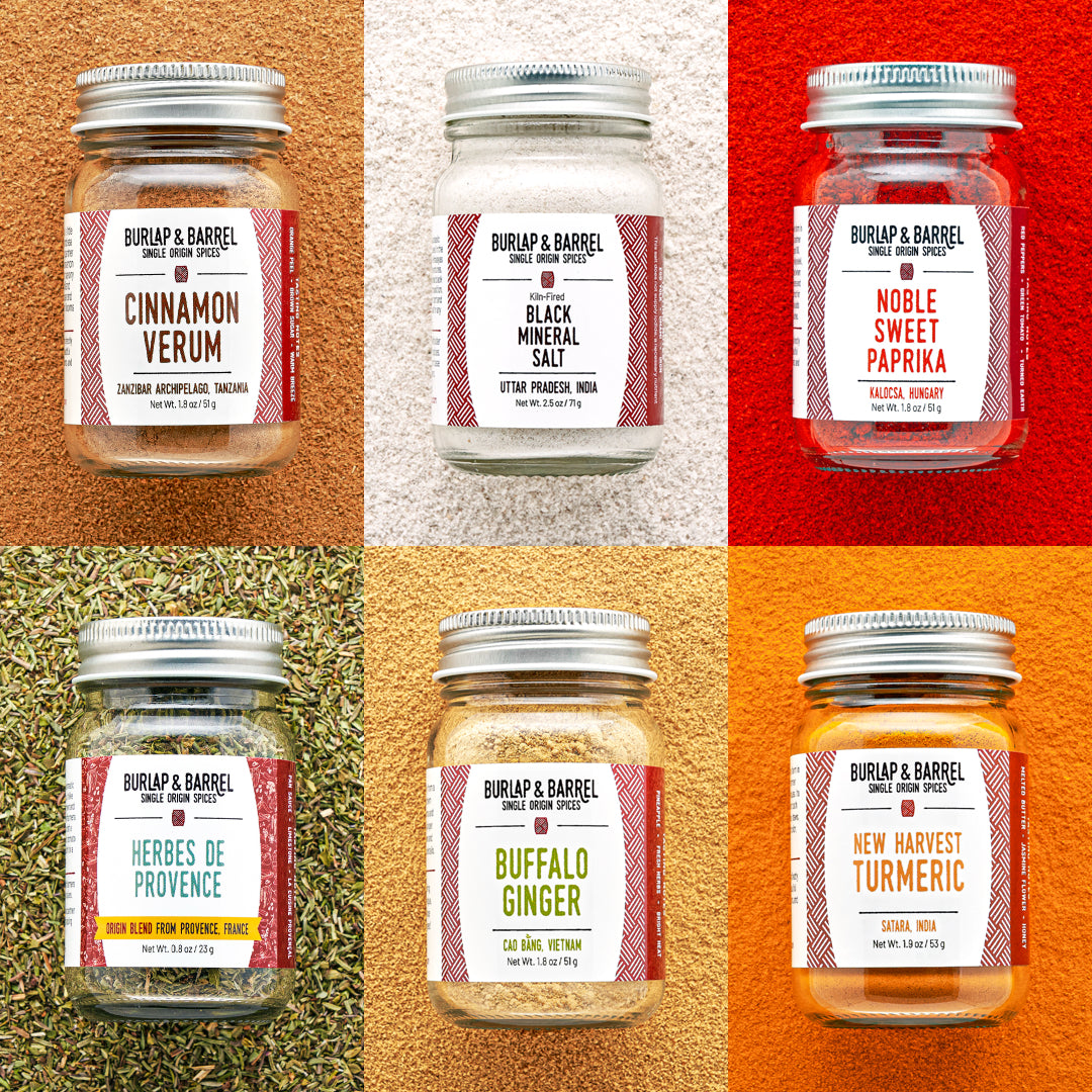 Collage of Burlap & Barrel spice jars with labels on a multicolored background