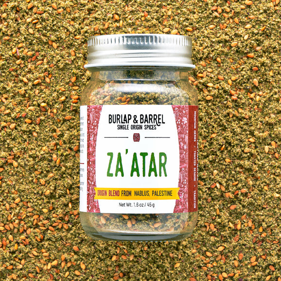 Jar of Za'atar spice blend from Burlap & Barrel on a textured spice background