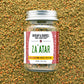 Jar of Za'atar spice blend from Burlap & Barrel on a textured spice background