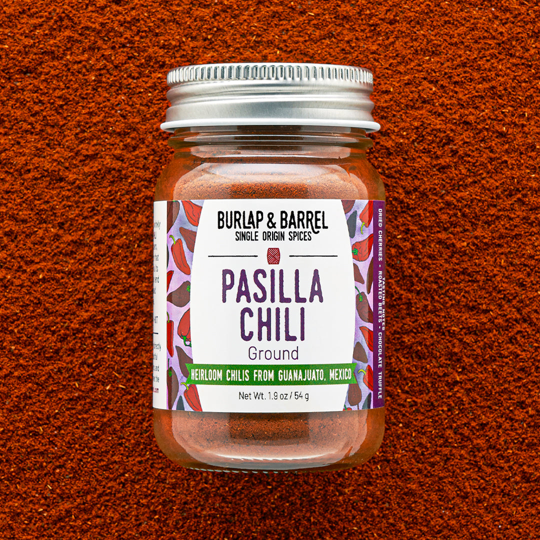 Jar of Burlap & Barrel Pasilla Chili on a textured brown background