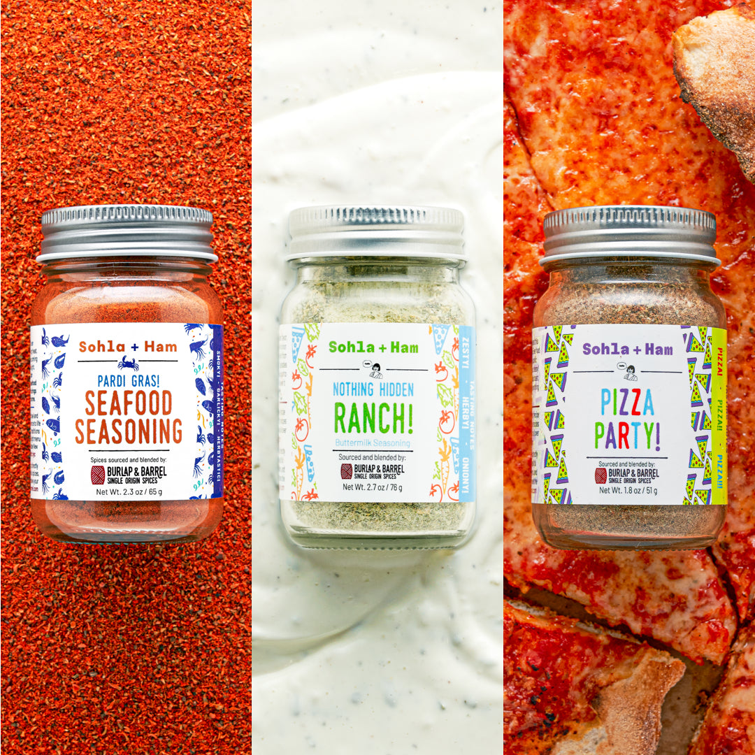 Three jars of Sohl & Ham seasoning on a pizza, bread, and ranch background