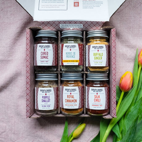 The Spring Essentials 6-Spice Collection in a beautiful gift box with Cured SUmac, Herbes de Provence, Buffalo Ginger, Purple Shallot Slices, Royal CInnamon, Silk Chili from Burlap & Barrel