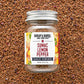 Jar of Burlap & Barrel Sumac Lemon Pepper on a textured brown background