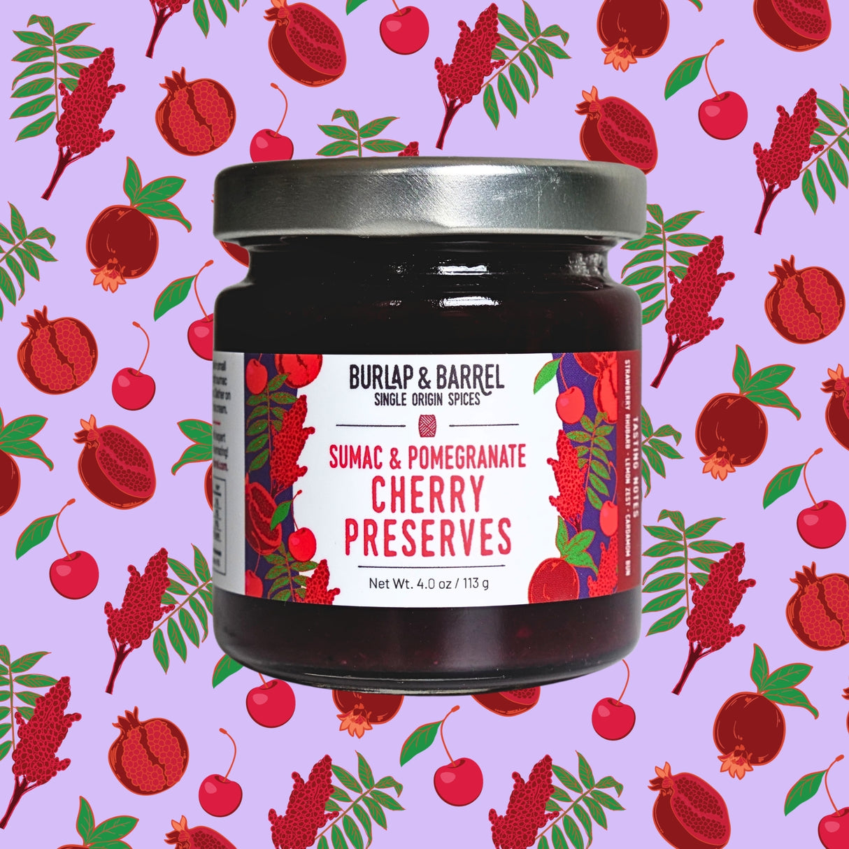 Jar of Burlap & Barrel Sumac & Pomegranate Cherry Preserves on a patterned background