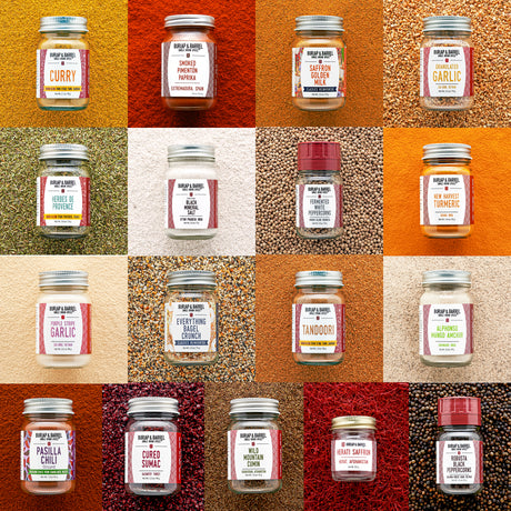 Grid of various jars of spices with labels on a textured background